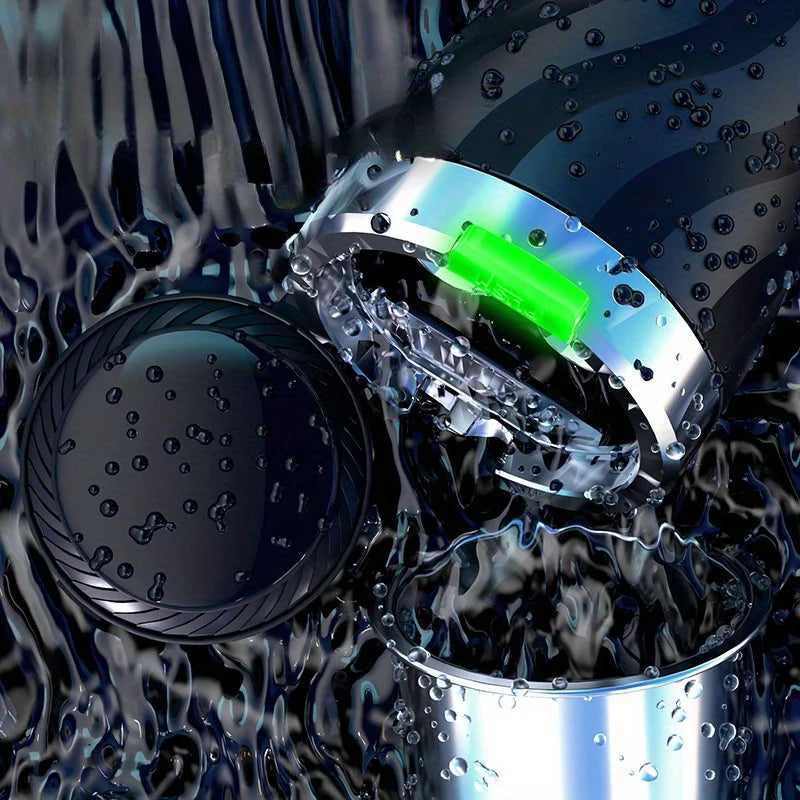 Close-up of a metallic object with a green light in a water-filled container