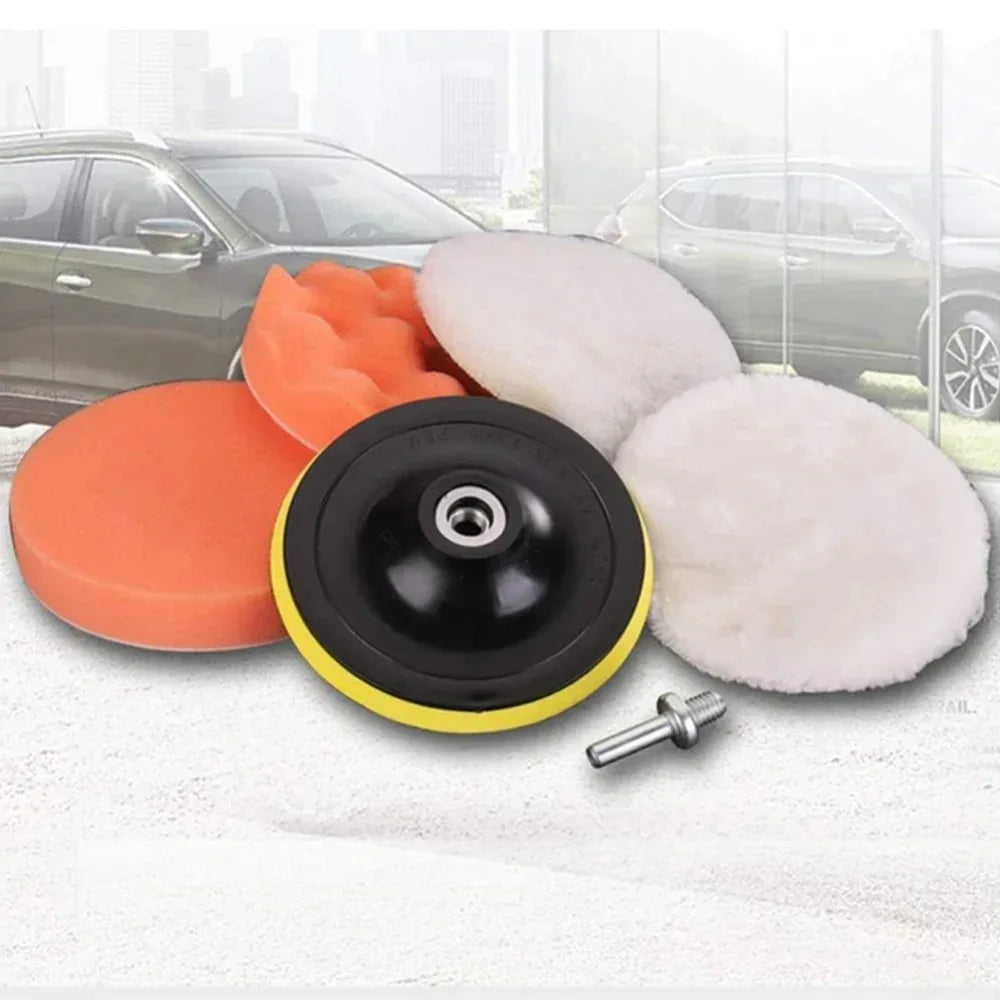 Set of car polishing pads with a car in the background