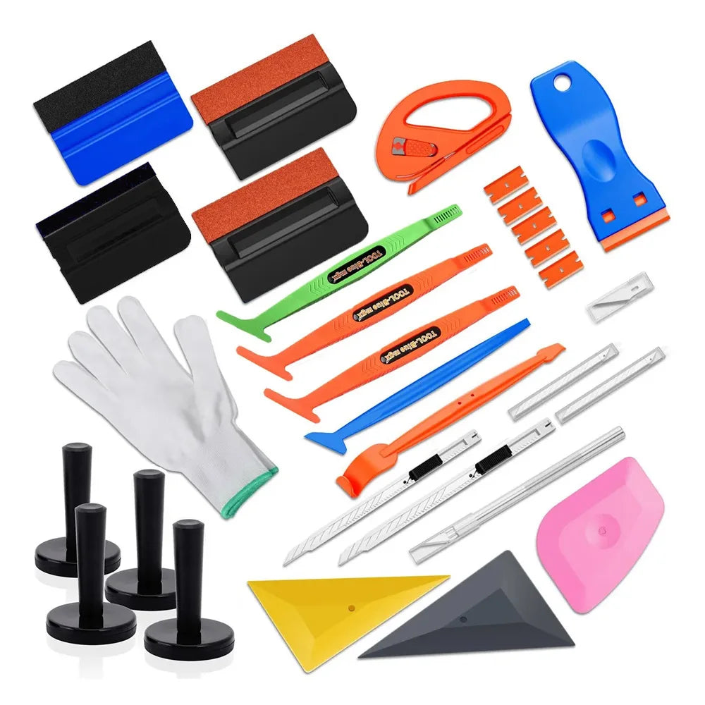 A comprehensive window tinting tool kit arranged on a clean white background. The kit includes various squeegees, scrapers, knives, triangles, and a protective glove in multiple colors including blue, orange, black, green, pink, yellow, and gray.