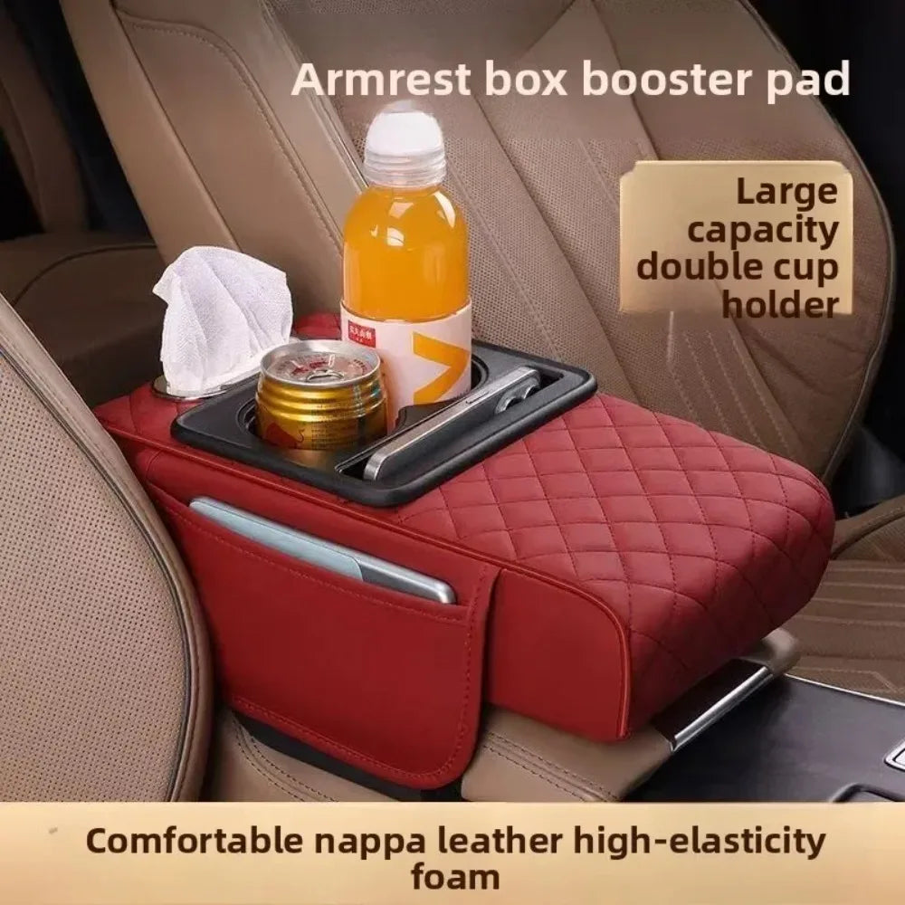 Red armrest box booster pad with cup holder and drink bottle in a car.