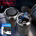 Car cup holders with built-in USB ports and black buttons on a car interior background.