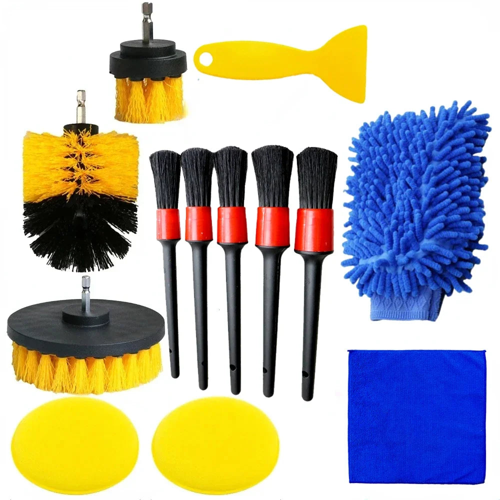 Set of car cleaning tools including brushes, sponges, and a mitt on a white background
