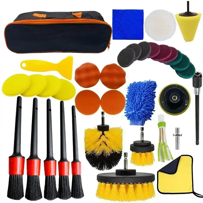 Collection of car cleaning tools including brushes, sponges, and polishing pads with a carrying case.